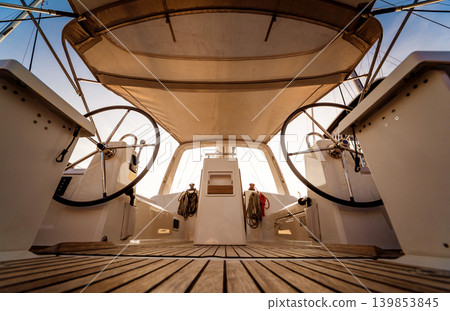 A modern speed boat yacht steering wheels. A modern speed boat yacht steering wheels. 139853845