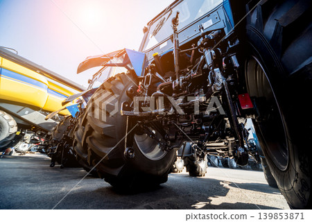 Rear view of modern agricultural tractor. Industrial details. Rear view of modern agricultural tractor. Industrial details. 139853871