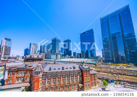 A magnificent view of Tokyo's urban landscape, including the auspicious Shinkansen bullet train, Doctor Yellow, Tokyo Station, the Shinkansen, and the buildings of Yaesu. A magnificent view of Tokyo's urban landscape, including the auspicious Shinkansen bullet train, Doctor Yellow, Tokyo Station, the Shinkansen, and the buildings of Yaesu. 139854138