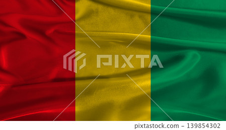 Flag of Guinea with fabric textured background. Close up of National flag of Guinea with realistic texture 139854302