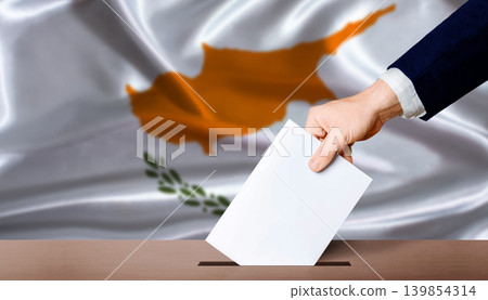 Cyprus Parliamentary vote. Hand placing a ballot in ballot box with the Cypriot flag in the background Cyprus Parliamentary vote. Hand placing a ballot in ballot box with the Cypriot flag in the background 139854314