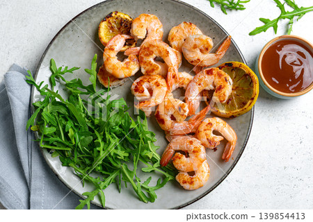 Grilled shrimps, prawns with arugula Grilled shrimps, prawns with arugula 139854413