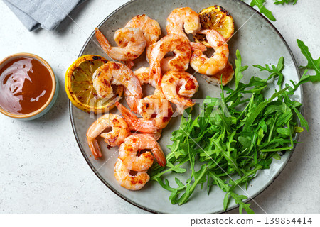 Grilled shrimps, prawns with arugula Grilled shrimps, prawns with arugula 139854414