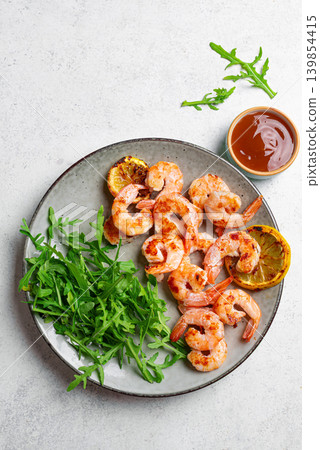 Grilled shrimps, prawns with arugula Grilled shrimps, prawns with arugula 139854415