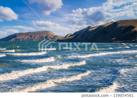 View of the open sea bay. Rocky seashore with blue sky. Beautiful nature. View of the open sea bay. Rocky seashore with blue sky. Beautiful nature. 139854561