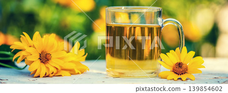 A cup of herbal tee in the garden 139854602