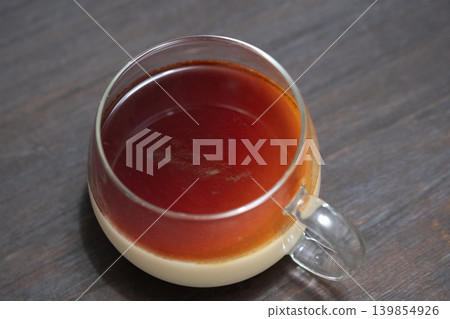 The image of homemade pudding topped with caramel. The image of homemade pudding topped with caramel. 139854926