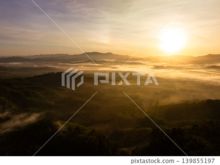 Aerial view Beautiful light sunset or sunrise over mountains landscape nature view Aerial view Beautiful light sunset or sunrise over mountains landscape nature view 139855197