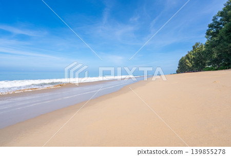 Beautiful sandy beach and sea with clear blue sky background Amazing beach blue sky sand sun daylight relaxation landscape view in Phuket island Thailand for Summer and travel background Beautiful sandy beach and sea with clear blue sky background Amazing beach blue sky sand sun daylight relaxation landscape view in Phuket island Thailand for Summer and travel background 139855278