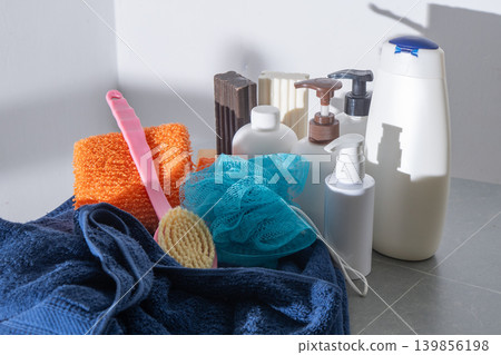 Set washing body and hair in the bathroom. Towel and washcloth, Bottles of shampoo, lotion and liquid soap. Shower gel. Set washing body and hair in the bathroom. Towel and washcloth, Bottles of shampoo, lotion and liquid soap. Shower gel. 139856198