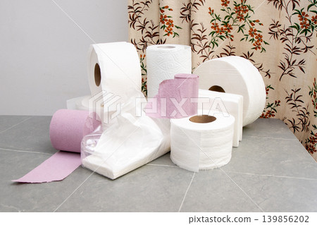 Rolls Of Toilet Paper Towels on gray background Rolls Of Toilet Paper Towels on gray background 139856202