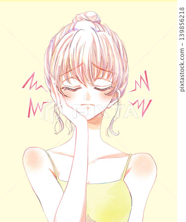 A woman with her hair in a bun holds one hand to her cheek in distress; it's stinging. 139856218