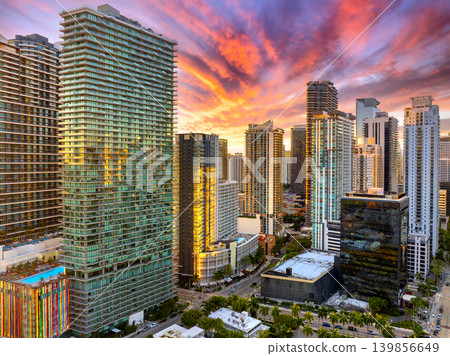 Miami, Florida, USA. Aerial view of American downtown office district at sunset. High commercial and residential skyscraper buildings in modern US city Miami, Florida, USA. Aerial view of American downtown office district at sunset. High commercial and residential skyscraper buildings in modern US city 139856649