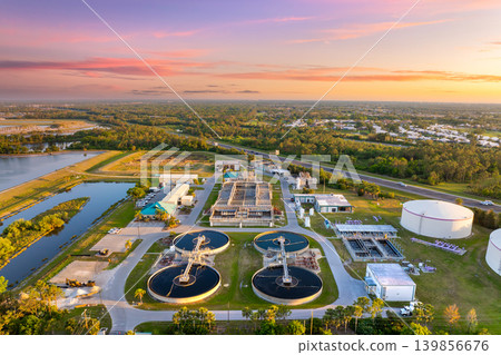 Large-scale industrial water treatment plant purifying and recycling water through filtration and chemical processes to meet health and safety standards Large-scale industrial water treatment plant purifying and recycling water through filtration and chemical processes to meet health and safety standards 139856676