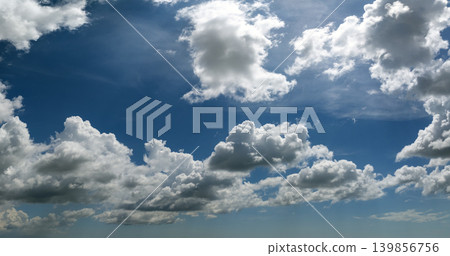 Blue sky with white summer rain clouds. Colorful summer landscape 139856756