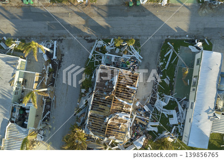 Hurricane destroyed suburban houses roofs in Florida mobile home residential area. Consequences of natural disaster Hurricane destroyed suburban houses roofs in Florida mobile home residential area. Consequences of natural disaster 139856765