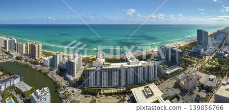 Miami Beach is popular vacation spot in southern Florida. Sandy beach surface and tourist infrastructure 139856766