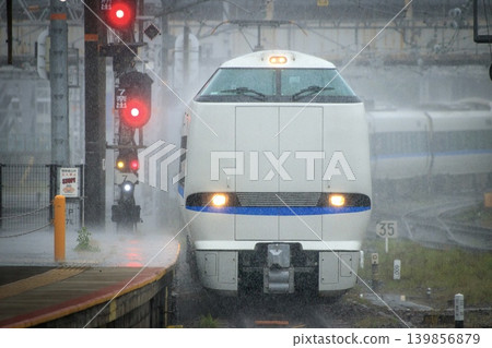 The 683 series Thunderbird limited express train pulls into Kyoto Station, battered by heavy rain. The 683 series Thunderbird limited express train pulls into Kyoto Station, battered by heavy rain. 139856879