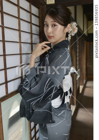 A young woman in a yukata A young woman in a yukata 139856935