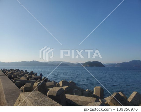 A landscape of tetrapods and a calm blue sea. A landscape of tetrapods and a calm blue sea. 139856970