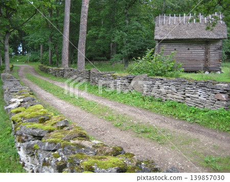 Stone walls and wooden houses at the Estonian Open Air Museum Stone walls and wooden houses at the Estonian Open Air Museum 139857030