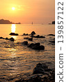Watching the sunrise from Enami Beach in Nichinan City, Miyazaki Prefecture. 139857122