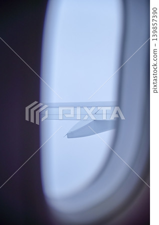 Looking from the airplane window with stunning skyscapes and landscape with airplane wing. Travel and transportation concept. Looking from the airplane window with stunning skyscapes and landscape with airplane wing. Travel and transportation concept. 139857390