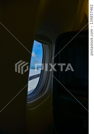 The inside of airplane, airplane window. Airplane window with beautiful skyscape. Travel and transportation concept. The inside of airplane, airplane window. Airplane window with beautiful skyscape. Travel and transportation concept. 139857462