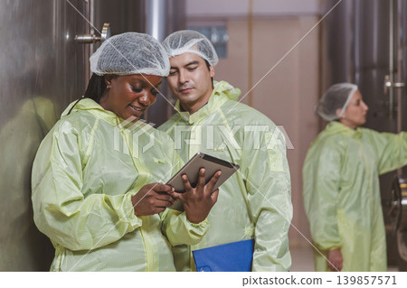 Winemaker working in modern large winery factory liquor drink industry quality. 139857571