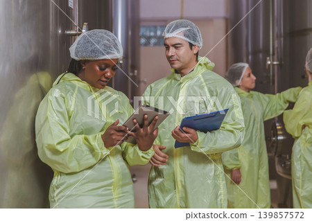 Winemaker working in modern large winery factory liquor drink industry quality. 139857572