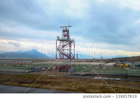 Looking from the airplane window of the landing scene. The scene of the airport apron. Travel and transportation concept. Looking from the airplane window of the landing scene. The scene of the airport apron. Travel and transportation concept. 139857619