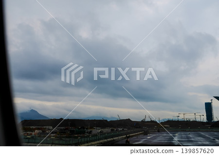 Looking from the airplane window of the landing scene. The scene of the airport apron. Travel and transportation concept. Looking from the airplane window of the landing scene. The scene of the airport apron. Travel and transportation concept. 139857620