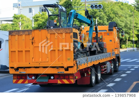 Truck transporting heavy machinery Truck transporting heavy machinery 139857908