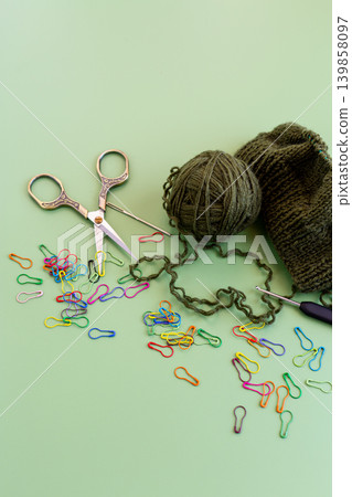 knitting process with wool yarn needles and colorful markers knitting process with wool yarn needles and colorful markers 139858097