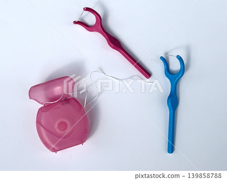 Dental floss and dental picks used for dental care Dental floss and dental picks used for dental care 139858788