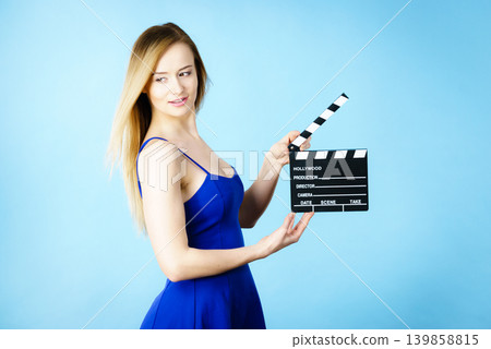 Woman holding professional film slate Woman holding professional film slate 139858815