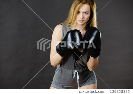 Boxer girl exercise with boxing gloves. Boxer girl exercise with boxing gloves. 139858825