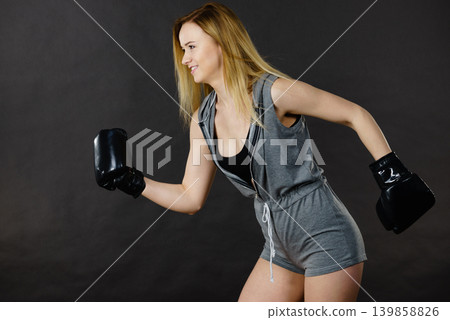 Boxer girl exercise with boxing gloves. Boxer girl exercise with boxing gloves. 139858826