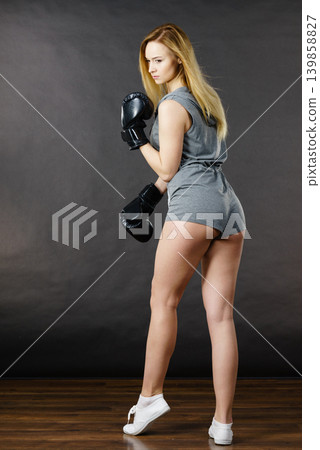 Boxer girl exercise with boxing gloves. Boxer girl exercise with boxing gloves. 139858827