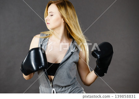 Boxer girl exercise with boxing gloves. Boxer girl exercise with boxing gloves. 139858831