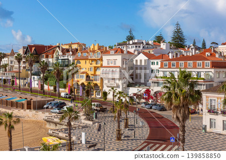Colorful waterfront houses and palm promenade in Cascais Portugal Colorful waterfront houses and palm promenade in Cascais Portugal 139858850