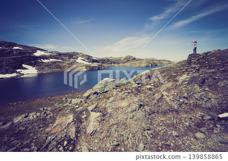 Tourist taking photo in norwegian nature 139858865