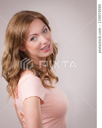Adult woman having curly brown hair Adult woman having curly brown hair 139859090