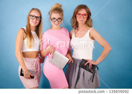 Elegant women wearing eyeglasses Elegant women wearing eyeglasses 139859092