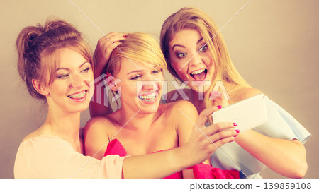Fashionable women taking selfie 139859108