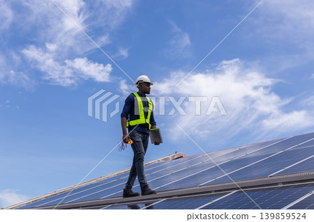 Engineer service check installation solar cell on the roof of factory. 139859524