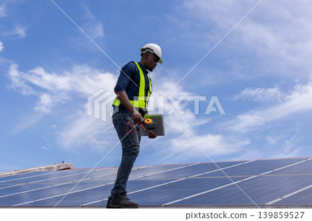 Engineer service check installation solar cell on the roof of factory. 139859527