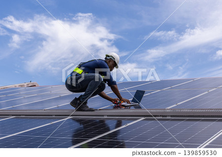 Engineer service check installation solar cell on the roof of factory. Engineer service check installation solar cell on the roof of factory. 139859530