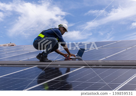 Engineer service check installation solar cell on the roof of factory. Engineer service check installation solar cell on the roof of factory. 139859531