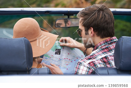 Map, travel and back of couple in a car for driving to vacation, adventure or holiday destination. Reading, navigation guide and young people on journey in vehicle for weekend road trip together. 139859568